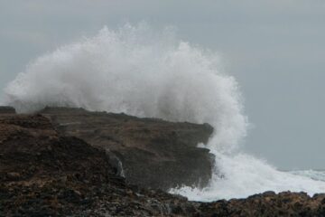 waves cliff crash